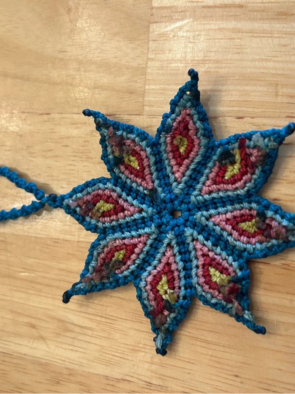 Handmade Rich Blue Macrame Flower Necklace with Red and Yellow Accents - Picture 5 of 6